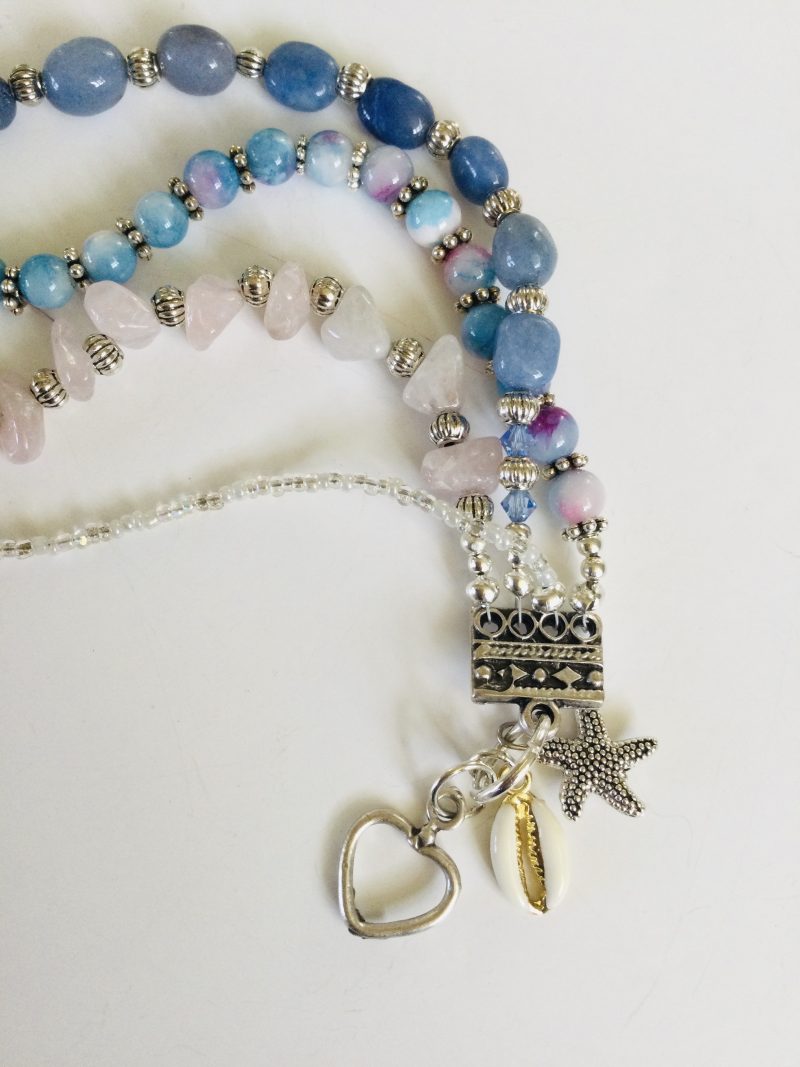 Multistrand bracelet featuring semiprecious stones in shades of blue, pink and silvery