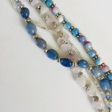 Multistrand bracelet featuring semiprecious stones in shades of blue, pink and silvery