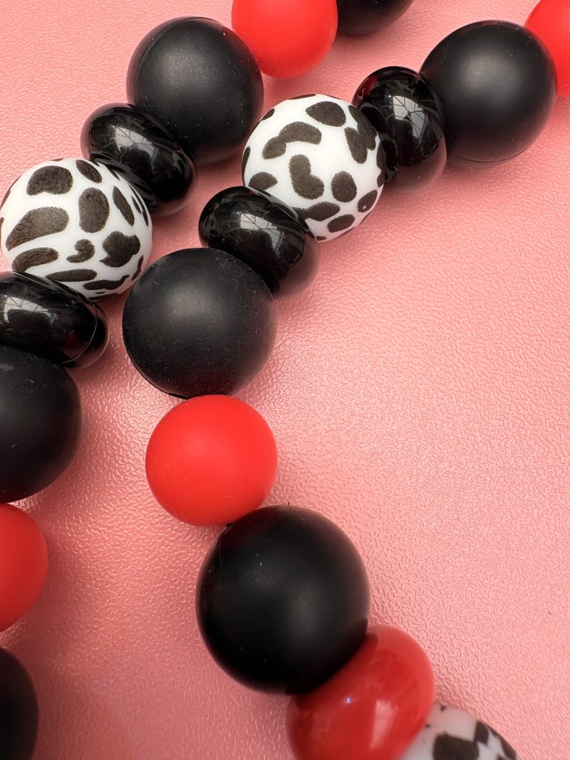Bold beaded black,red and Dalmatian print bow centre necklace