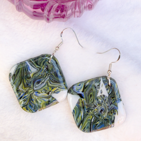 Square shaped polymer clay earrings with green and blue swirls.