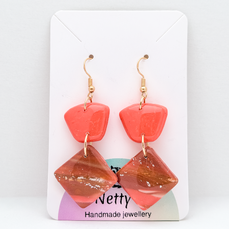 Handmade, 2 tier orange polymer clay earrings.
