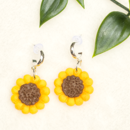 Small sunflower design polymer clay single drop earrings.