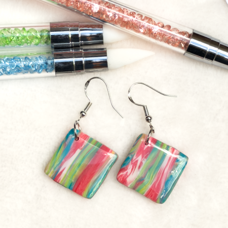 Small, square shaped polymer clay earrings in various colours.