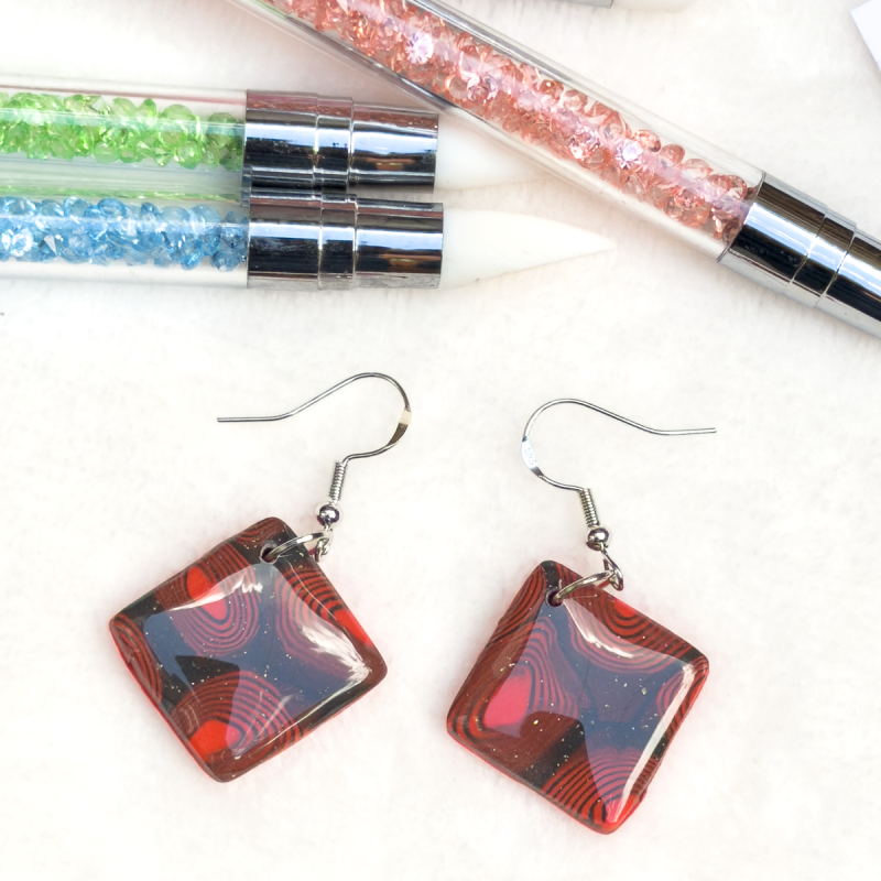 Small, square shaped polymer clay earrings in various colours.
