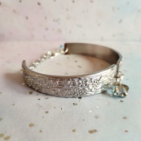 Handmade stainless steel spoon handle bracelet with glass butterfly charm.