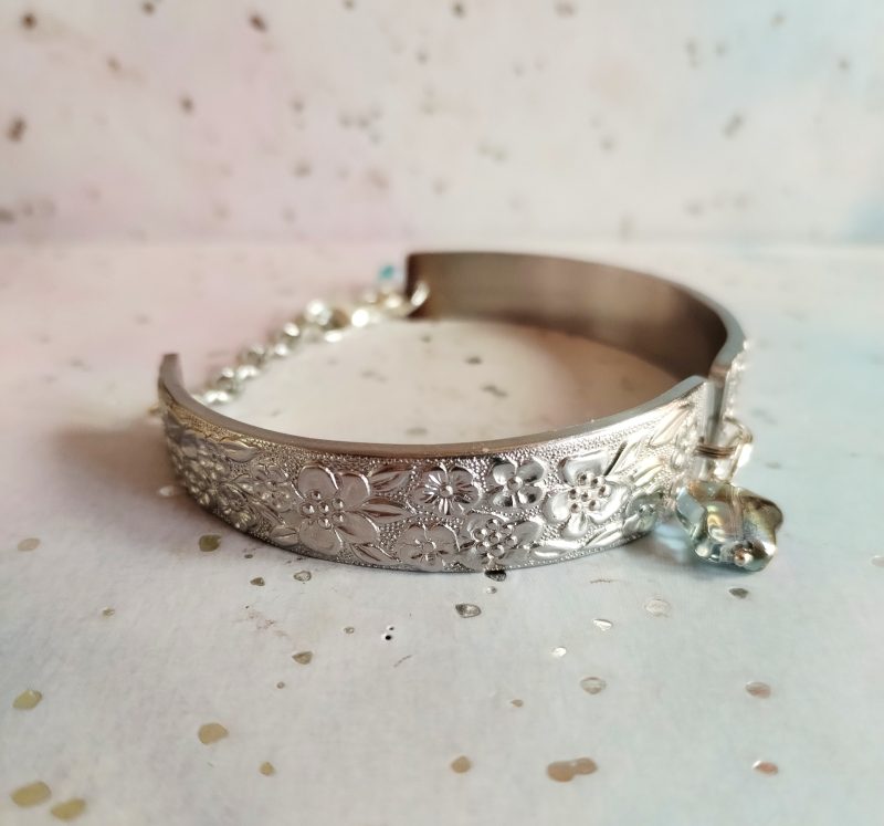 Handmade stainless steel spoon handle bracelet with glass butterfly charm.