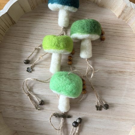 Hand felted forest inspired mushroom hanger.