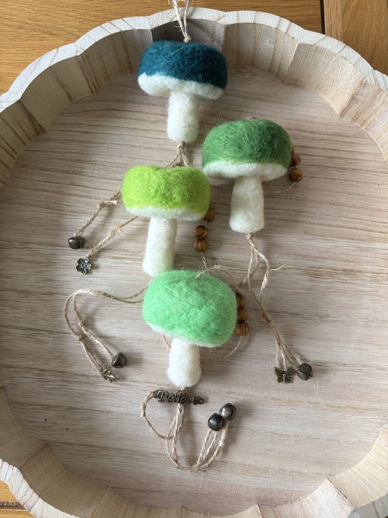 Hand felted forest inspired mushroom hanger.
