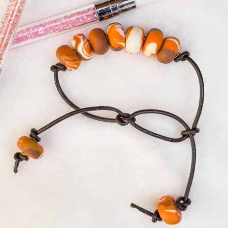 Beaded clay bracelet in various colours.