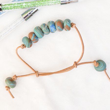 Beaded clay bracelet in various colours.