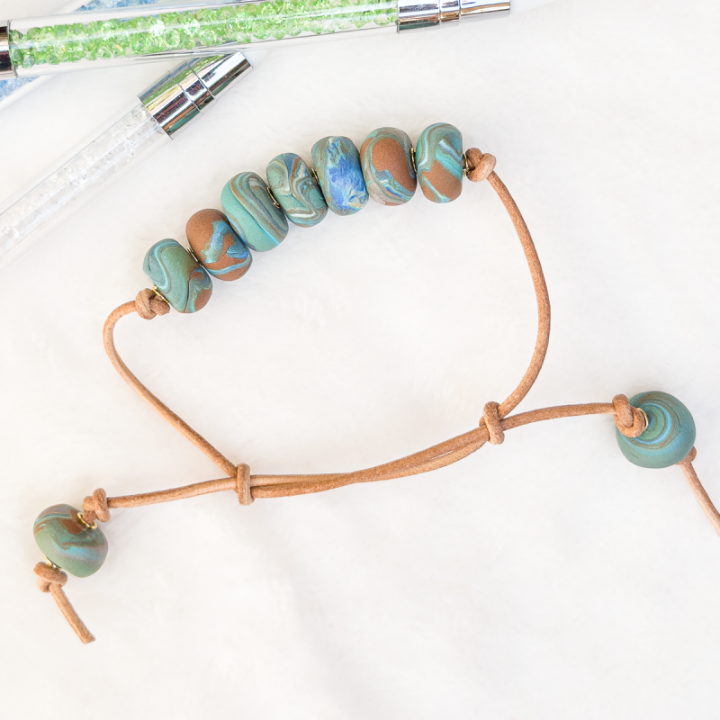 Beaded clay bracelet in various colours.