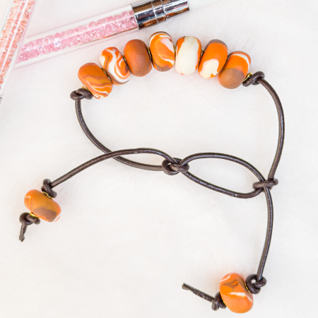 Beaded clay bracelet in various colours.