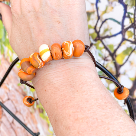 Beaded clay bracelet in various colours.