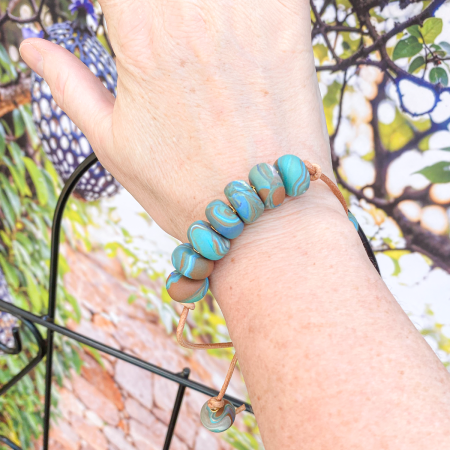 Beaded clay bracelet in various colours.