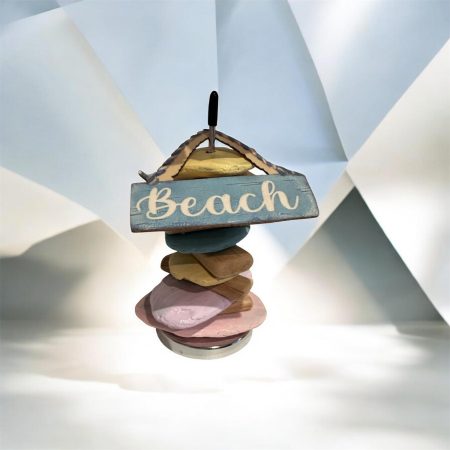 Balancing stones in pastel colours with Beach logo