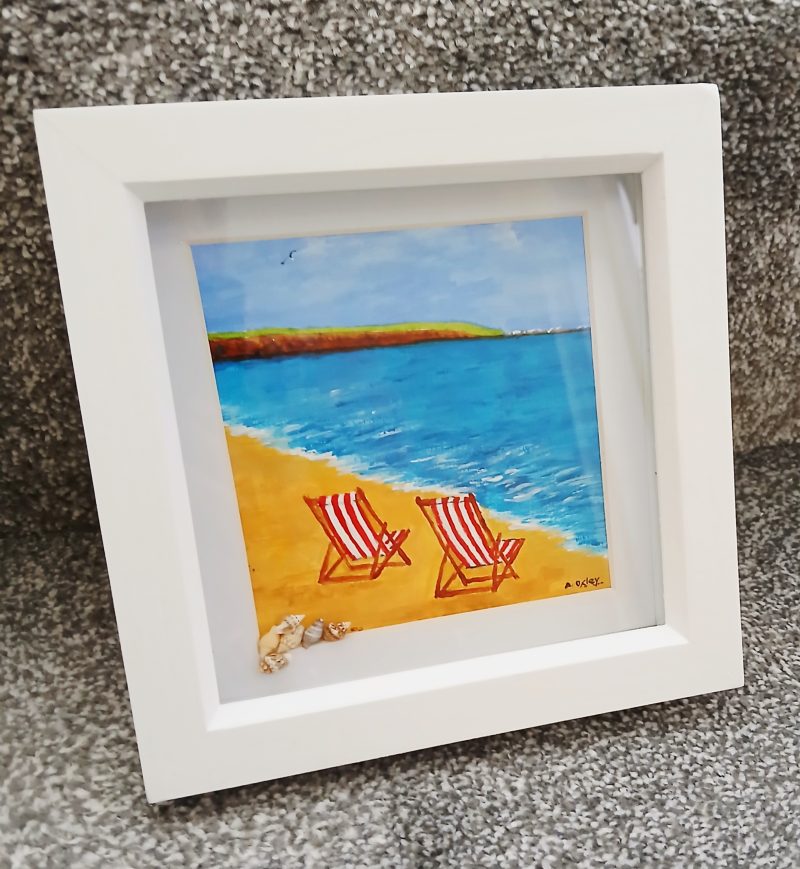Framed Acrylic Painting of Filey Brigg with Deck Chairs and Shells
