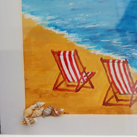 Framed Acrylic Painting of Filey Brigg with Deck Chairs and Shells