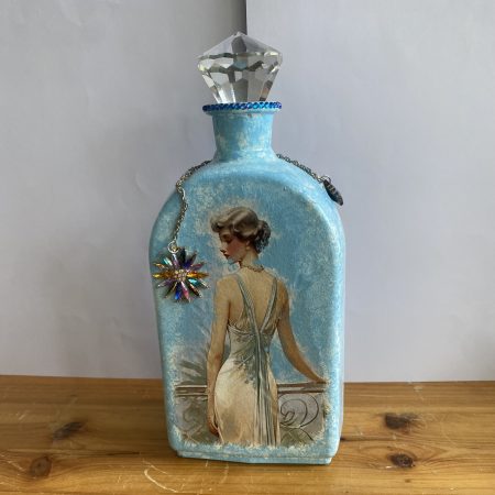 Hand painted decoupaged bottle in blue