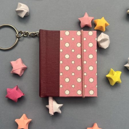 Handmade Notebook Keyring | 48 pages | Burgundy book cloth spine with pink cover with white dots | Unlined paper