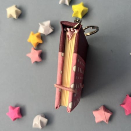 Handmade Notebook Keyring | 48 pages | Burgundy book cloth spine with pink cover with white dots | Unlined paper