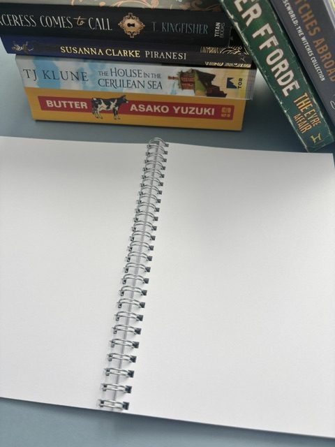 Wire bound plain unlined notebook | 70 pages | A5 | Softcover | Purple | Stack of books hand drawn design