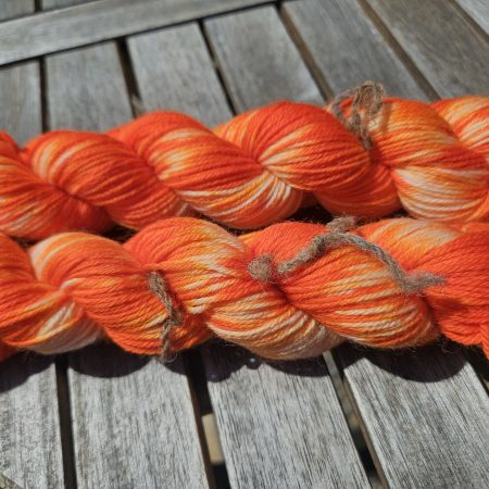 Hand dyed 100% wool yarn.