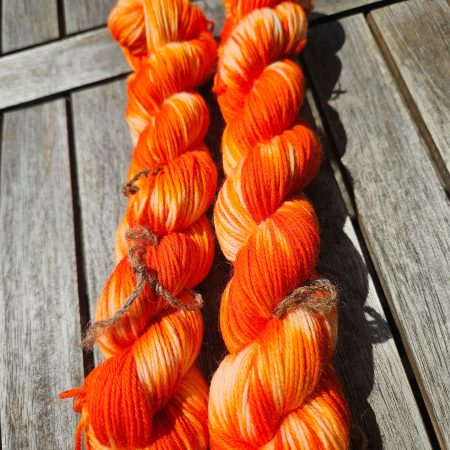 Hand dyed 100% wool yarn.