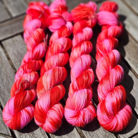 Hand dyed 100% wool yarn.