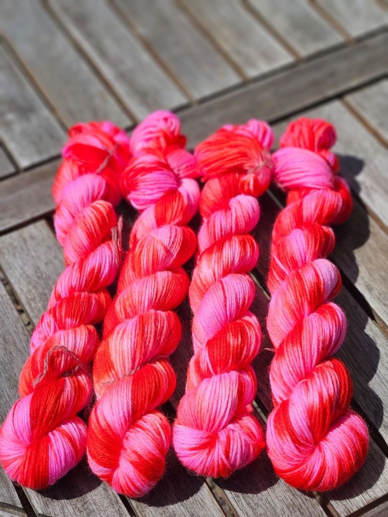 Hand dyed 100% wool yarn.