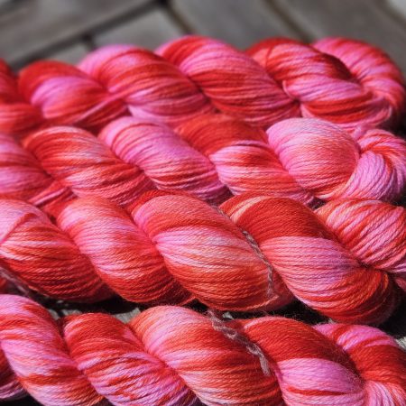 Hand dyed 100% wool yarn.