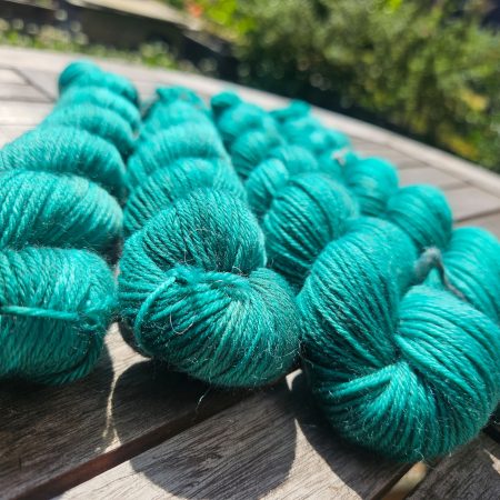 Hand dyed 100% wool yarn.