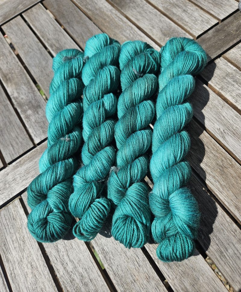 Hand dyed 100% wool yarn.
