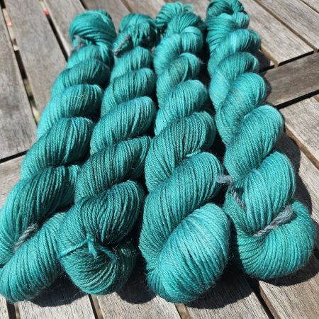 Hand dyed 100% wool yarn.