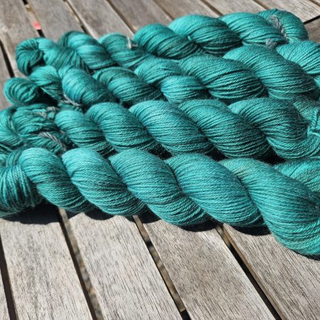 Hand dyed 100% wool yarn.