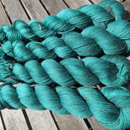 Hand dyed 100% wool yarn.