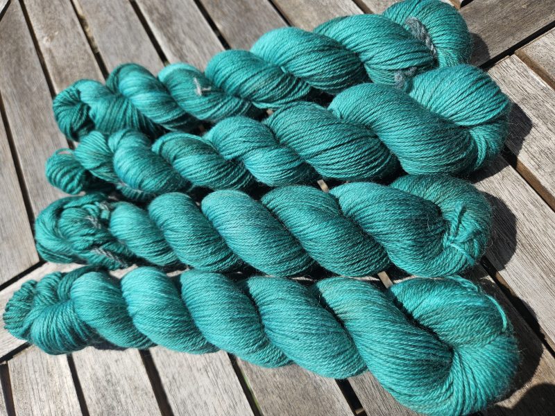 Hand dyed 100% wool yarn.