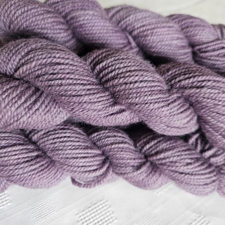 Hand dyed 100% wool yarn.
