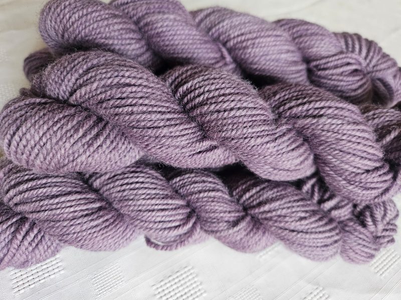 Hand dyed 100% wool yarn.