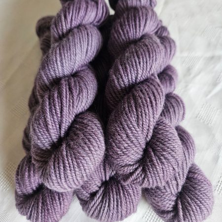 Hand dyed 100% wool yarn.