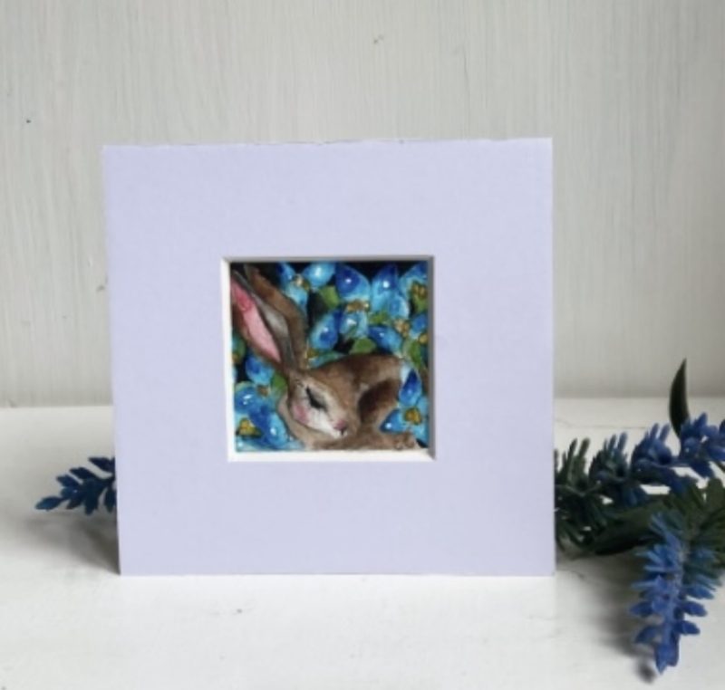 ACEO Mounted Original Resting Hare / Rabbit surrounded by Blue Flowers Watercolour