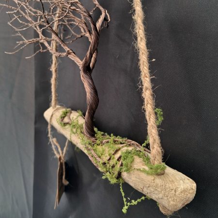 Windswept wire tree on natural driftwood