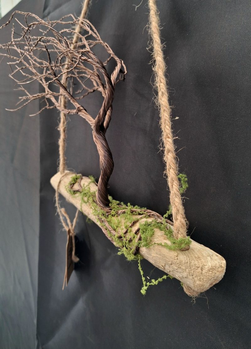 Windswept wire tree on natural driftwood