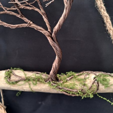Windswept wire tree on natural driftwood