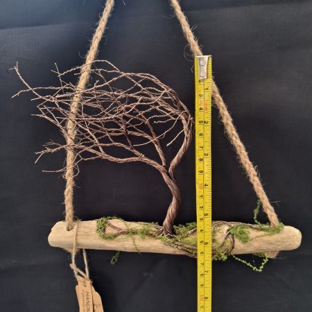 Windswept wire tree on natural driftwood
