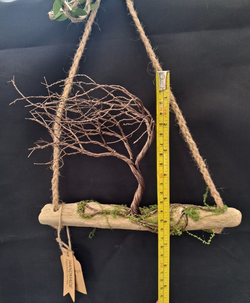 Windswept wire tree on natural driftwood