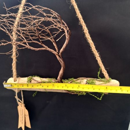 Windswept wire tree on natural driftwood