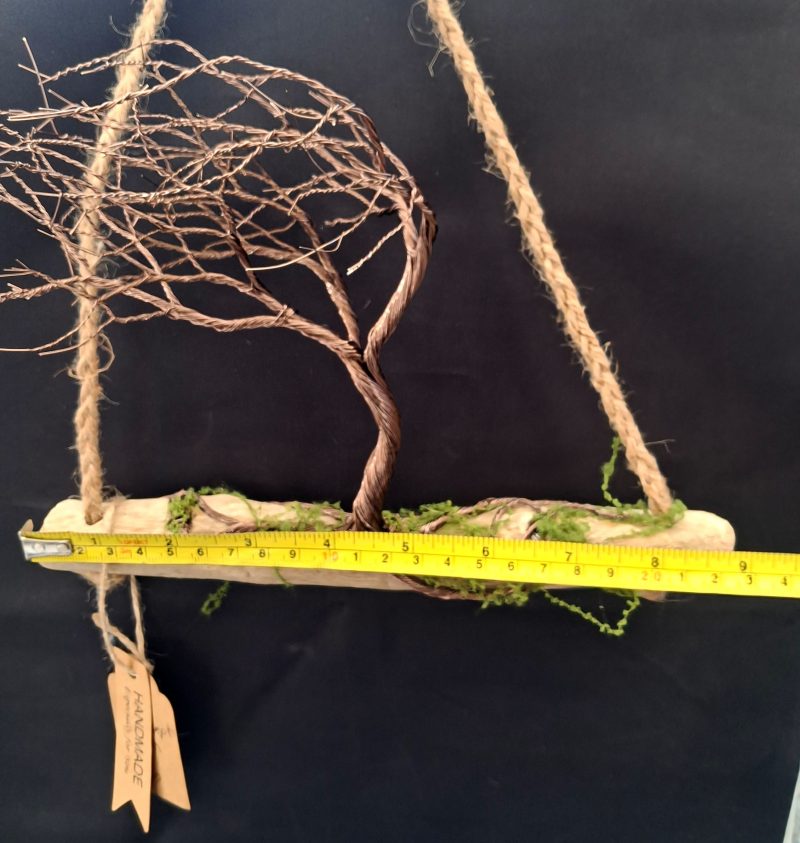 Windswept wire tree on natural driftwood