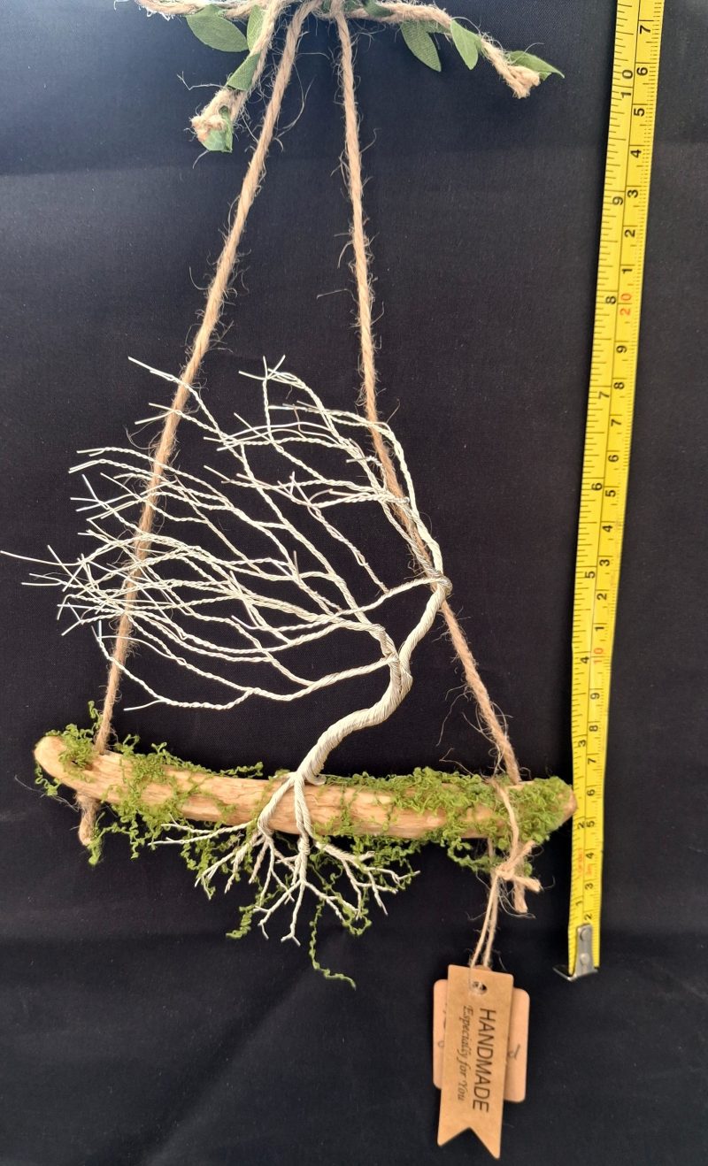 Small silver colour windswept tree on natural driftwood