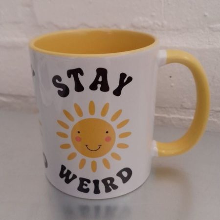 Stay Weird mug with smiling sun - brighten your day!