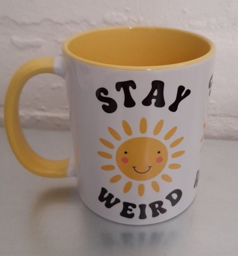 Stay Weird mug with smiling sun - brighten your day!